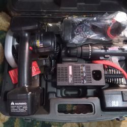 Saw And A Portable Grill Set In The Case