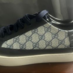 Original Gucci sneakers in very good condition, very clean, and blue in color.