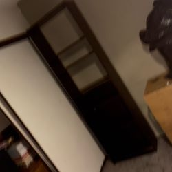 Black wood cabinet with adjustable shelves 79 inches tall