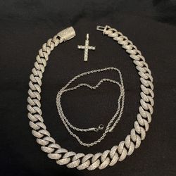 Silver Cuban Link Chain Set Featuring A Cross Pendant 