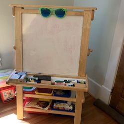 Easel with bins and small table with 2 chairs. You of table can be used as a blackboard. In great condition was used in a therapy office! $250 for