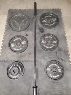Olympic Weight Set With 7ft 35lb bar 2x45lbs 2x35lbs 2x25lbs Thats 245lbs all together With the Bar