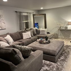 Couch ottoman, TV with tv stand and fire place  And coffee table 