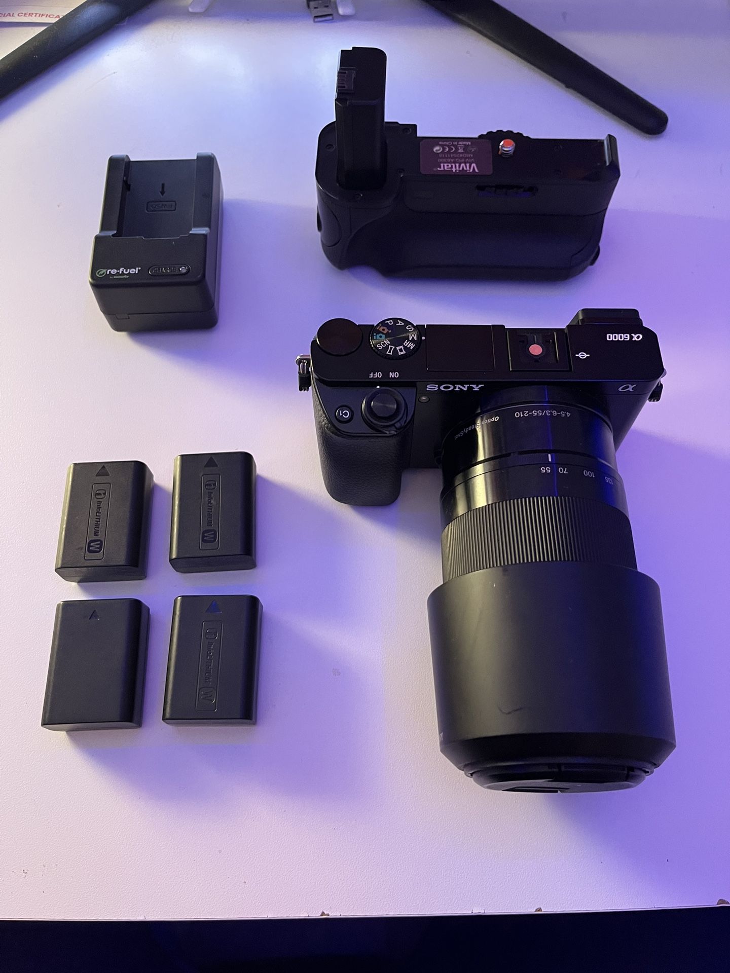Sony a6000 Mirrorless Camera with Sony 55-210mm f4.5-6.3 E OSS Lens also with Battery Grip