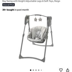 Graco Slim Spaces Compact Baby Swing, Space Saving Portable Bay Swing with Height Adjustable Legs & Soft Toys, Reign