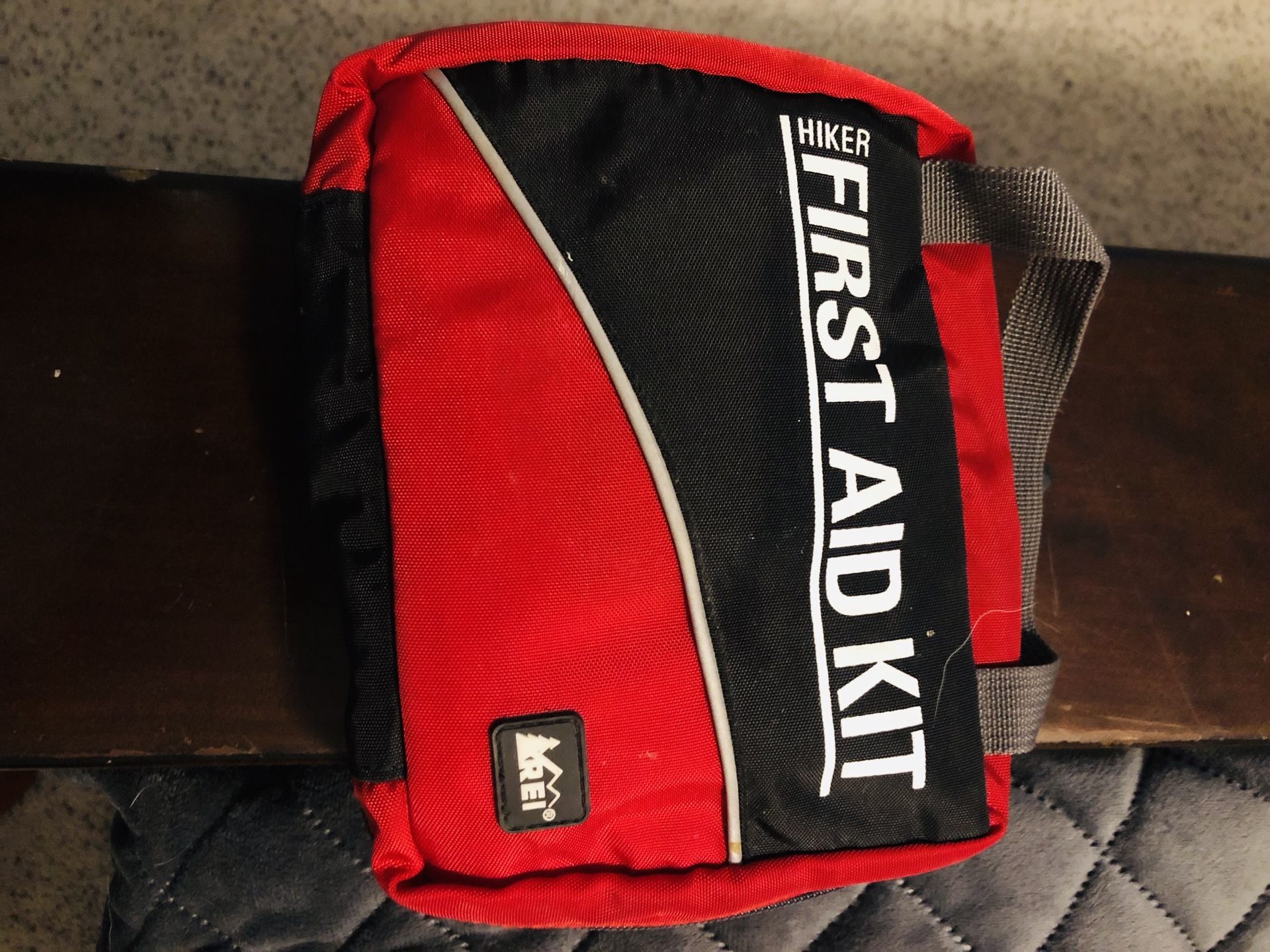 REI First Aid kit, Bivvy cover, rucksack, and light weight mummy sleeping bag. All REI NAME BRAND