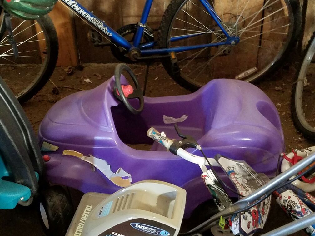 Purple pedal car