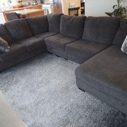 Practically new high end Gray sectional from Broadway furniturePractically new high end Gray sectional from Broadway furniture