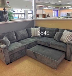 Sectional  sofa with  pull-out bed  & reversible  storage
