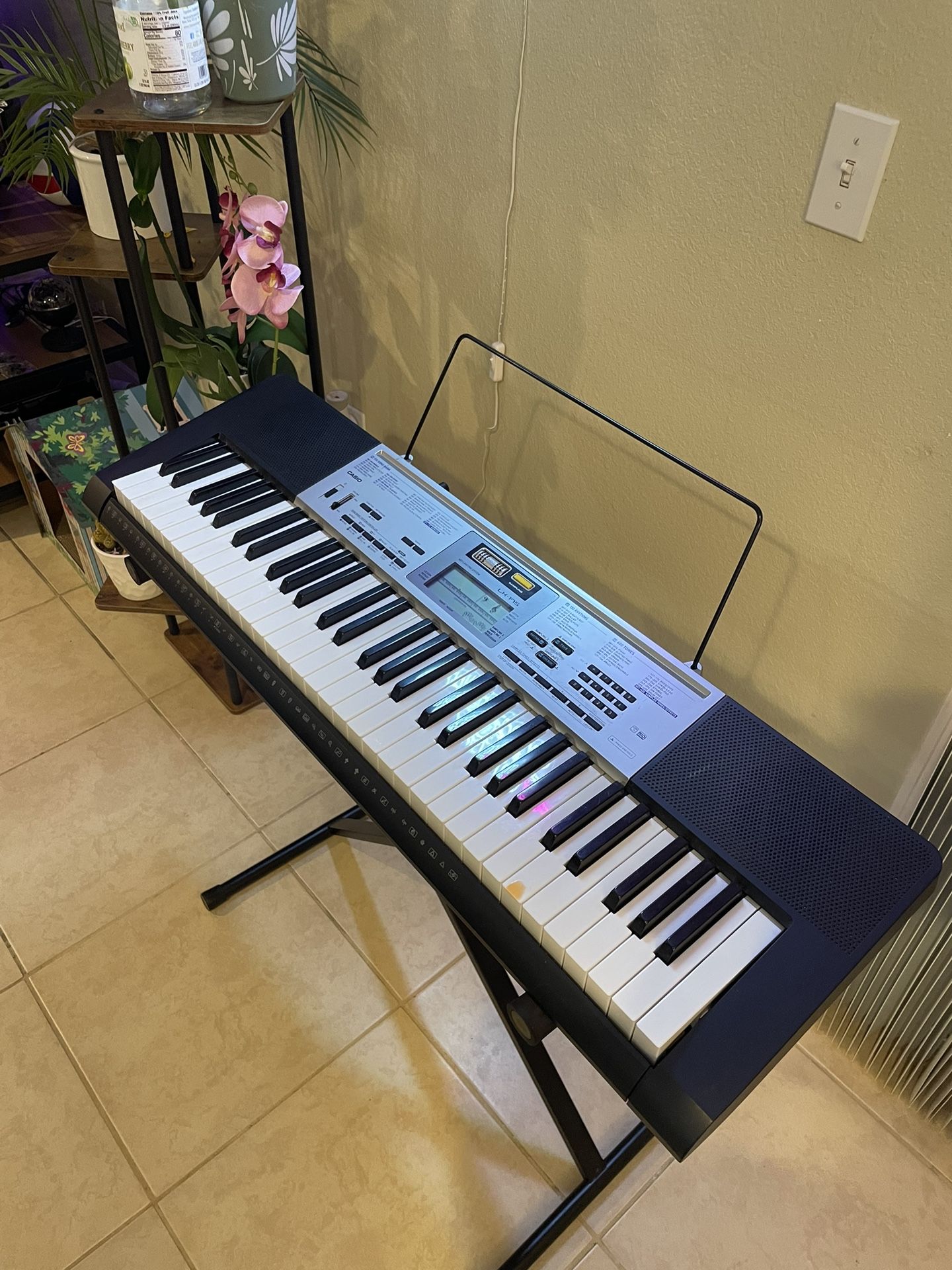 Casio Piano Keyboard 61 Keys- Works Perfectly. Sheet music display and keyboard stand included.