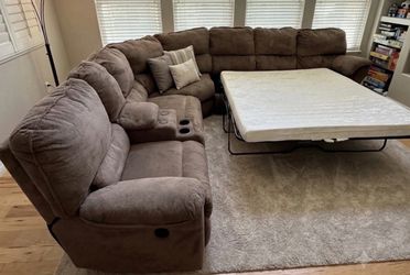 Brown electric recliner couch with pullout bed good condition clean they sell all the time delivery $40