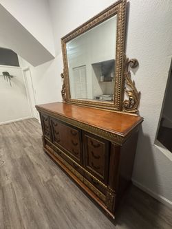 Italian vintage Pulaski Dresser with mirror  Birch wood with mahogany finish and gold leaf details .