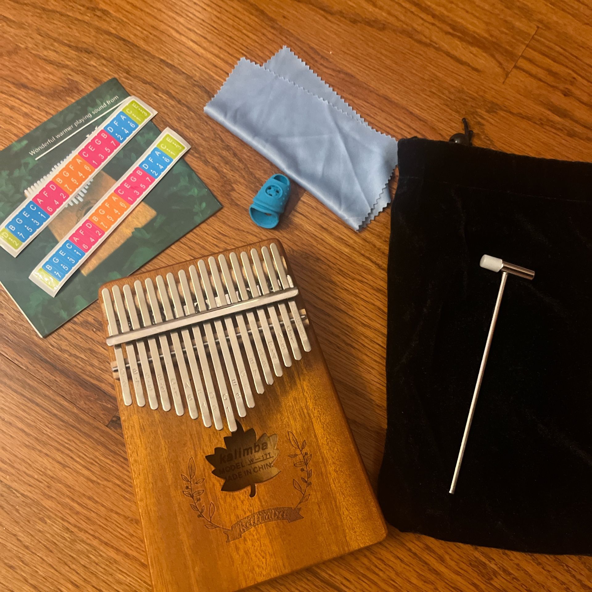 Kalimba with case, tuning hammer, and other accessories