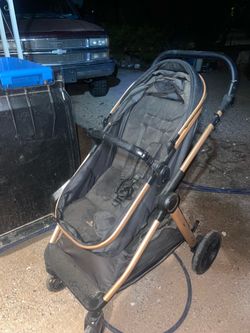 Baby Stroller with Gold Frame Accents