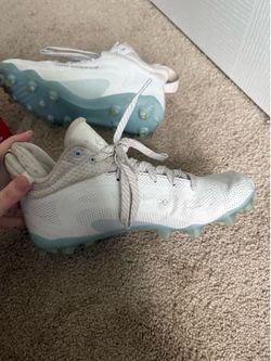Girls lacrosse cleats.
