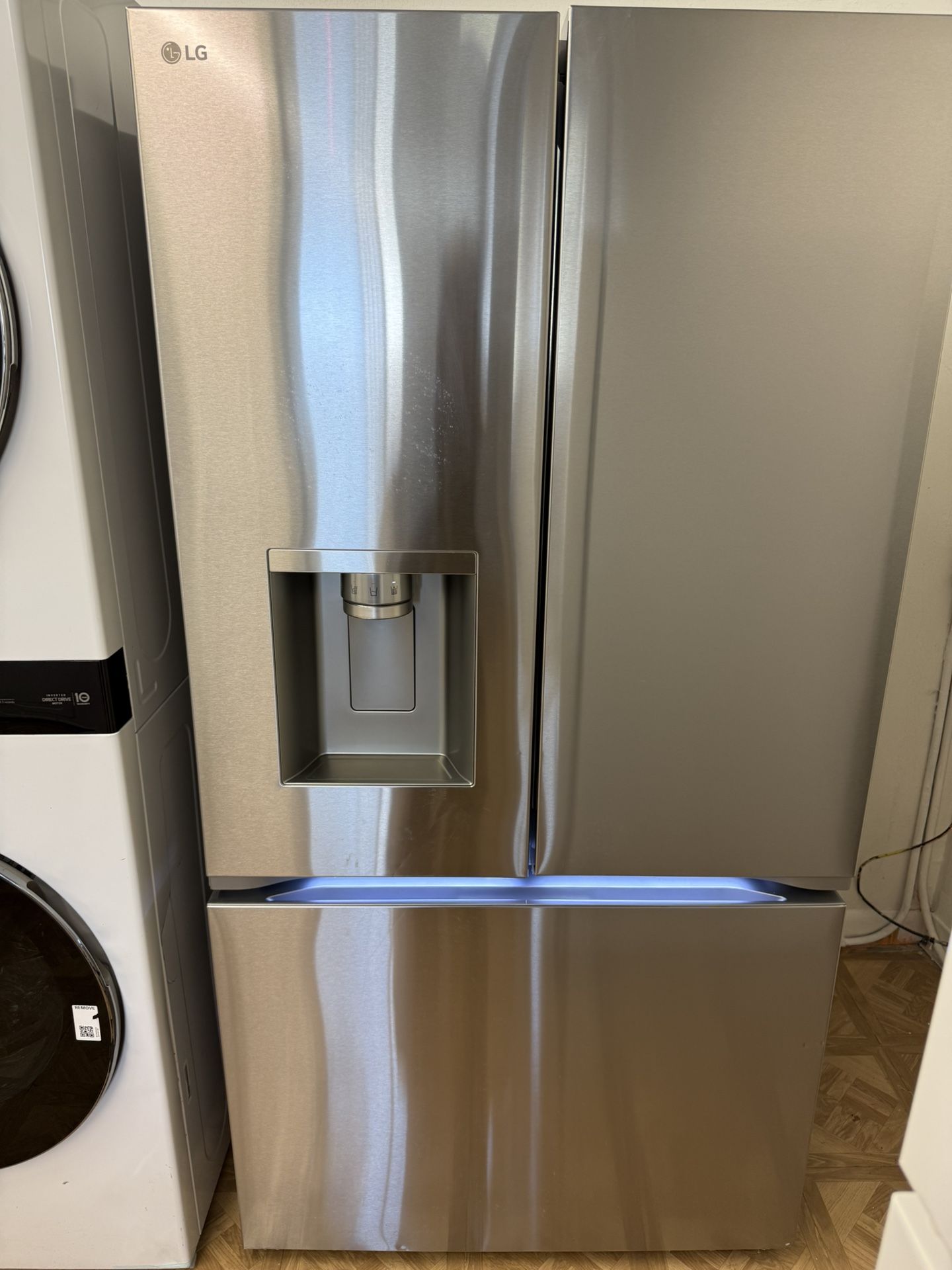 LIKE NEW LG FRENCH DOOR STAINLESS STEEL REFRIGERATOR.