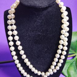 Vintage Divine Pearlescence Necklace is an 18-inch piece of vintage women's jewelry that is perfect for adding a touch of elegance to any outfit. This