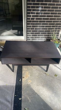 Black/dark ikea wood grain coffee table with some chips/scratches