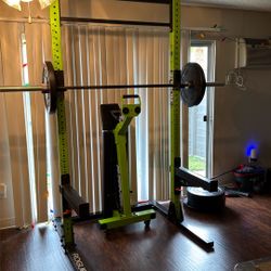 Rogue Squat Rack With Barbell And Weights 