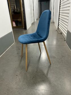8 blue velvety dining chairs. (Priced per)