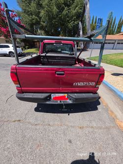Pickup Truck Red with Ladder Rack