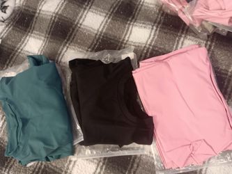 New exercise sportswear have pink and black you can buy my set or you can buy them individual pants and blouse for women sizes medium through 4X