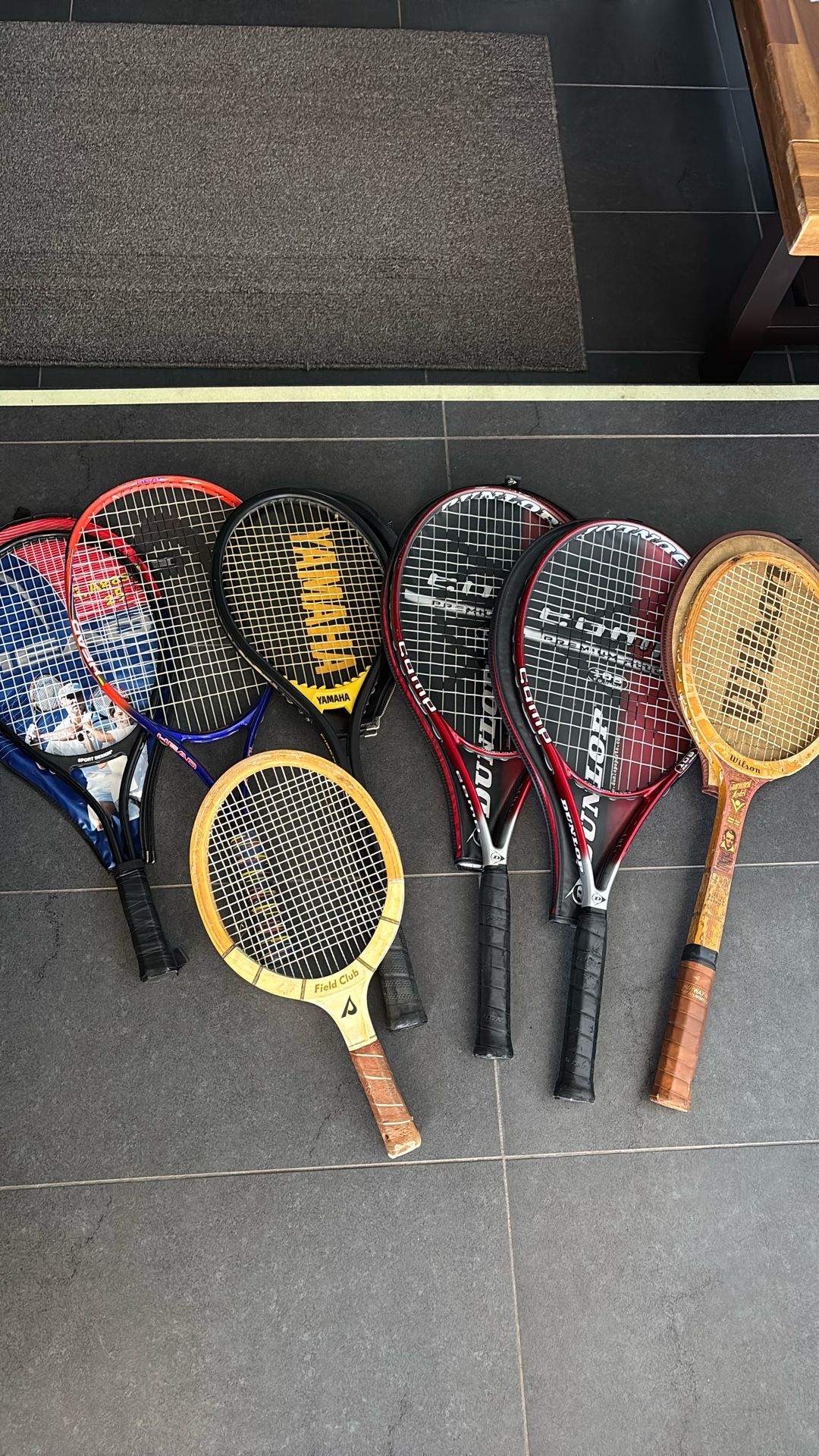 Six Tennis Rackets And One Handball Racket