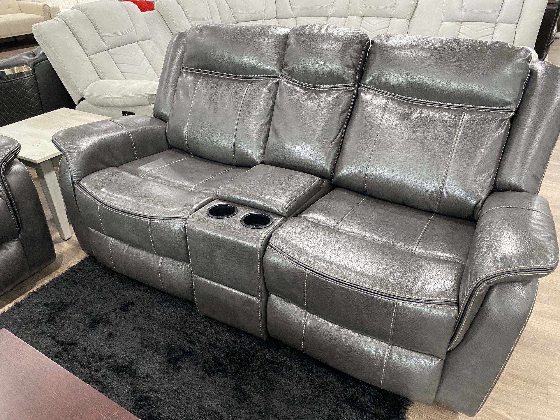 Gorgeous Reclining Loveseat With Center Console And Stainless Steel Cupholders
