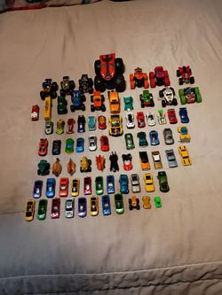 65 Hot Wheels of various styles and sizes and years.