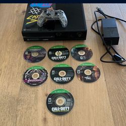 Broken Xbox One, Games, Power Cord, and Wired Controller 