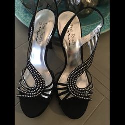 Women’s Formal black satin heel sandals with sequin detail and with stretch back strap. Good condition. Never worn outside.