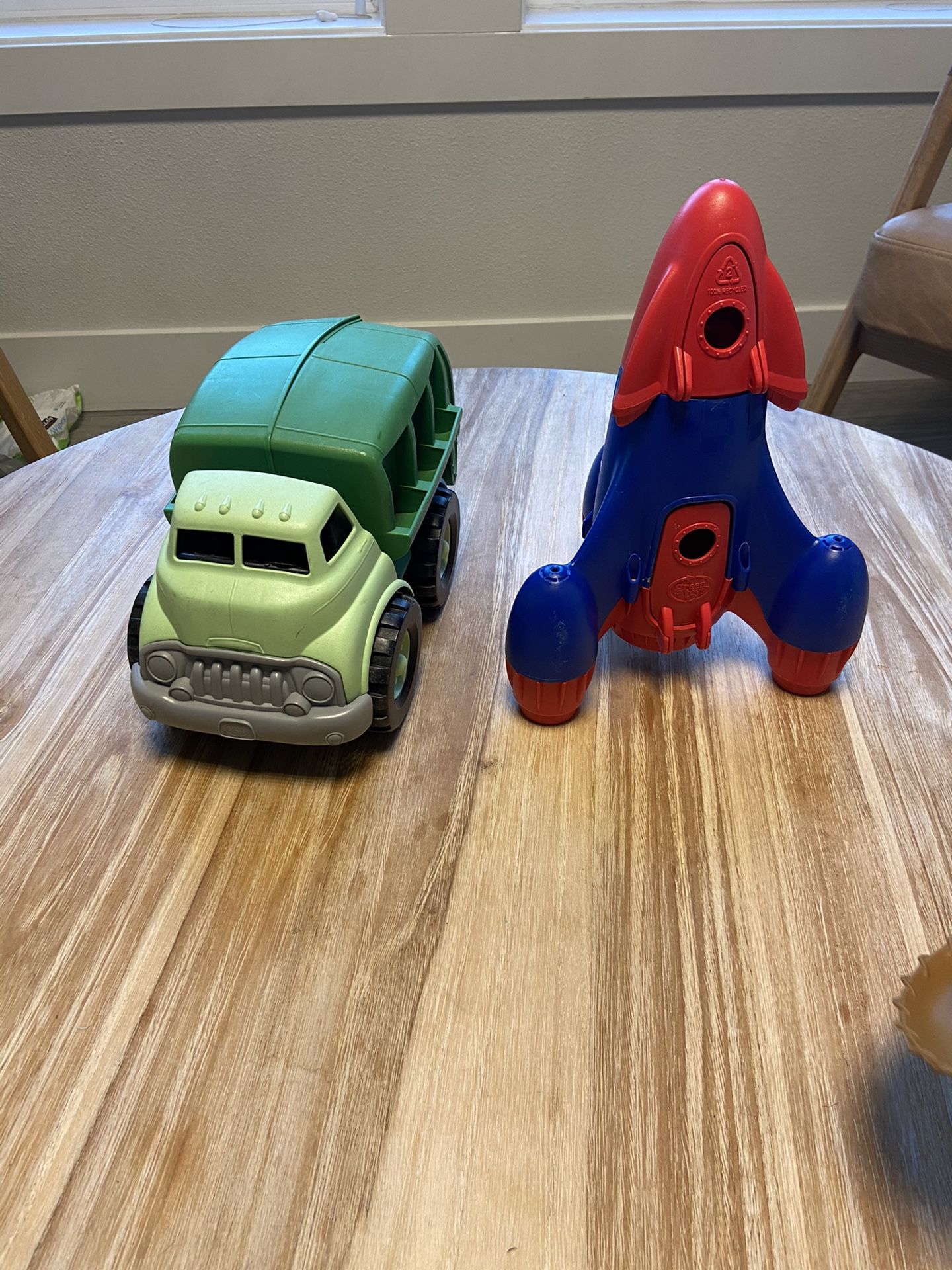 Green toy brand rocket and recycling truck