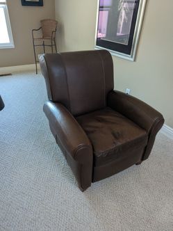 Brown leather recliner chair -powered