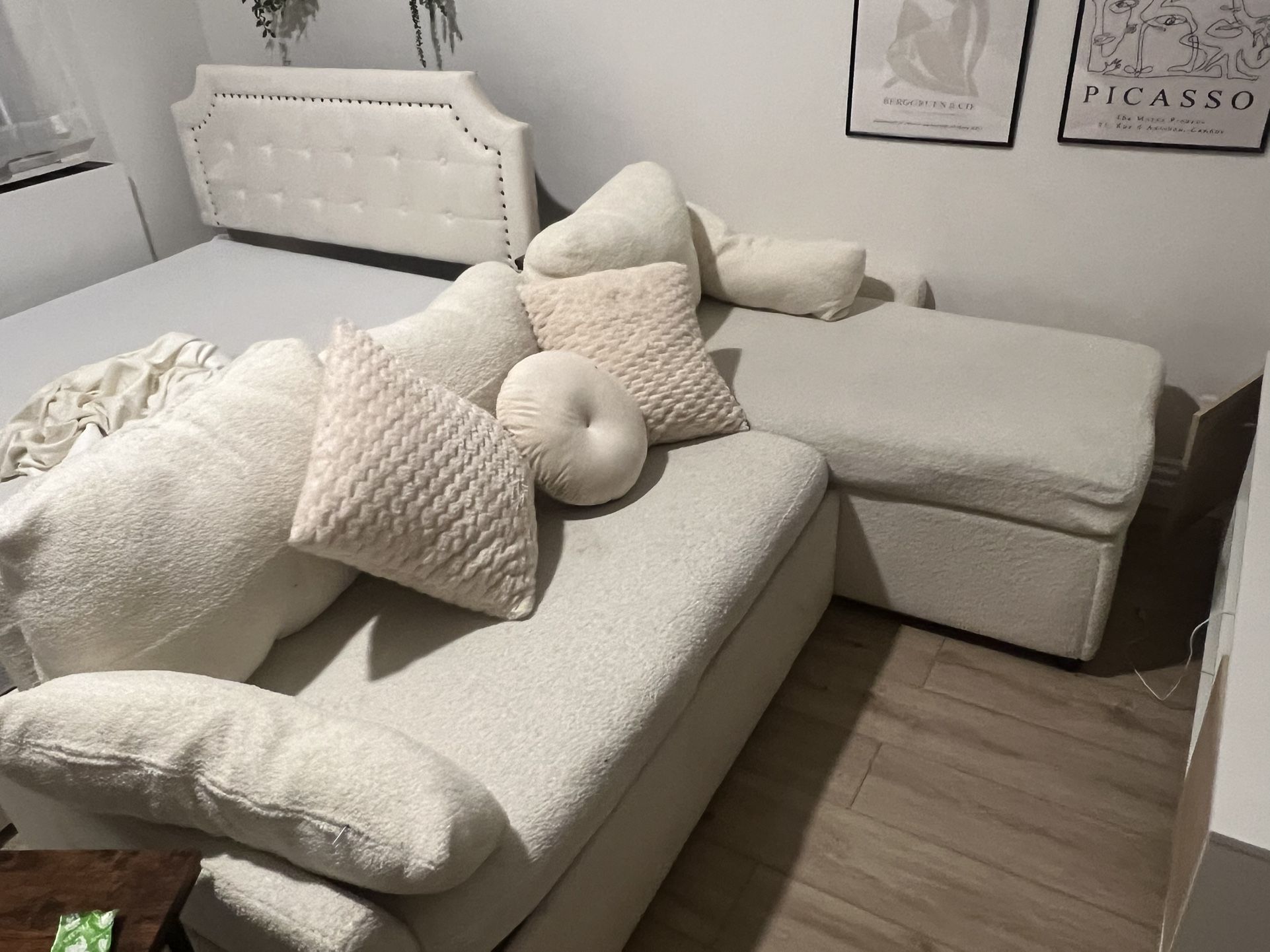 L shaped couch with pillows