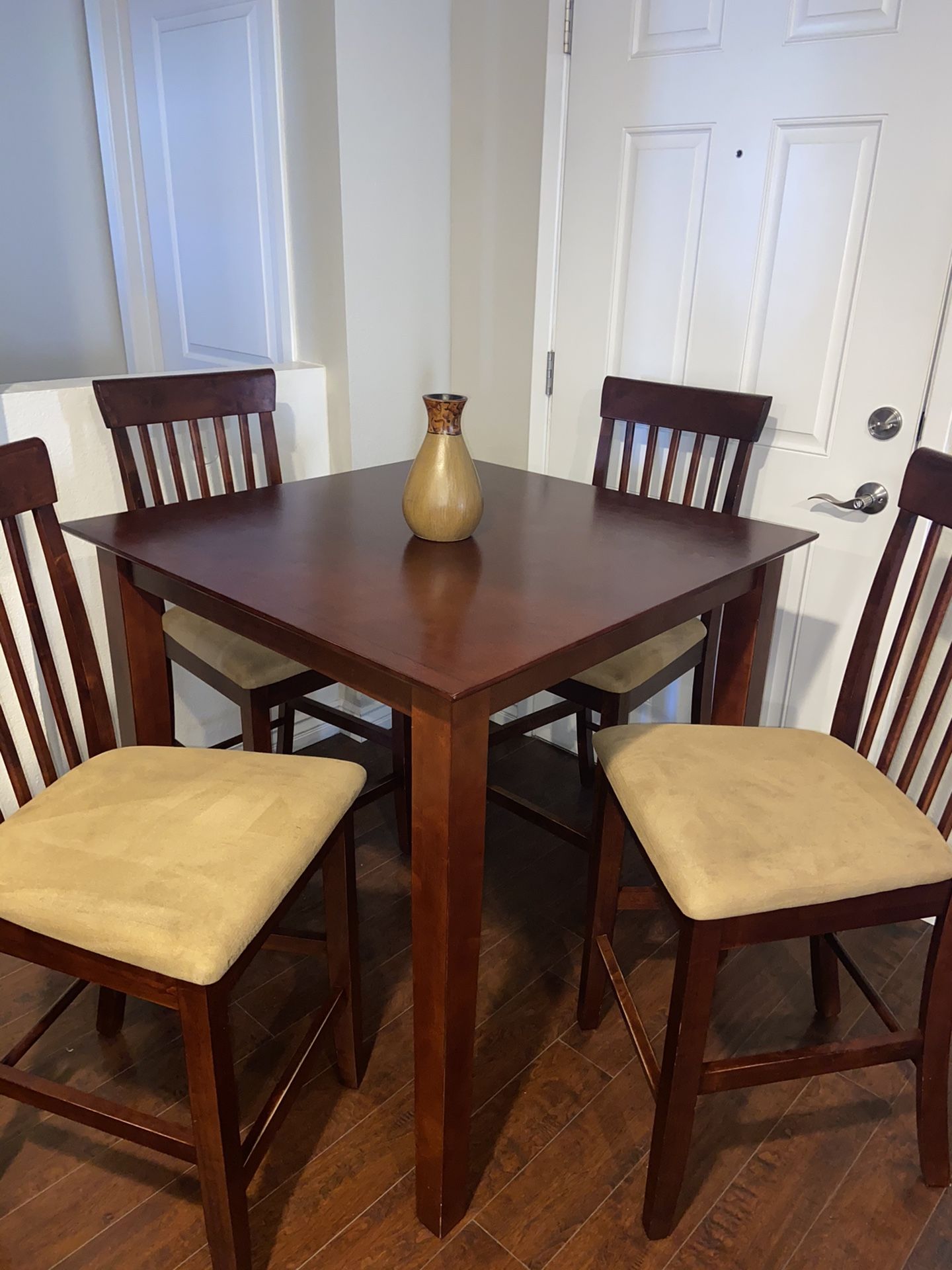 High top dining table with four chairs