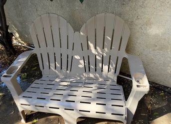 White Plastic Adirondack Double Bench and two chairs