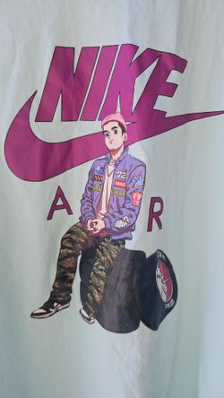 Nike Sportswear Moto Car Tire Racing Graphic Men Tee 
Cool Nike t-shirt. Is a light blue color. Has a fun anime-style graphic with a character sitting