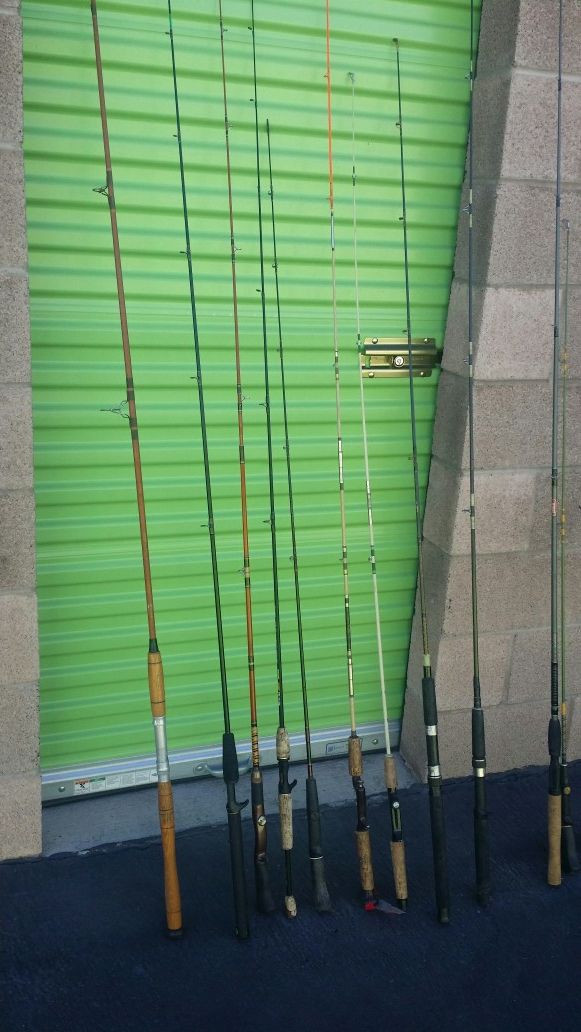 A couple of dozen fishing rods about eight or nine of them have reels ... $8