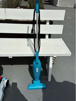 BISSELL FeatherWeight Stick Lightweight Bagless Vacuum in a blue color.