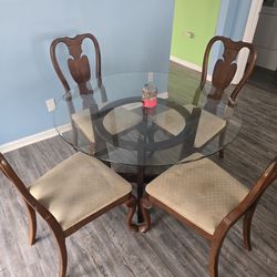 Glass table with 4 chairs
