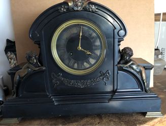 Antique Ansonia black mantle clock with brass finish trimming
