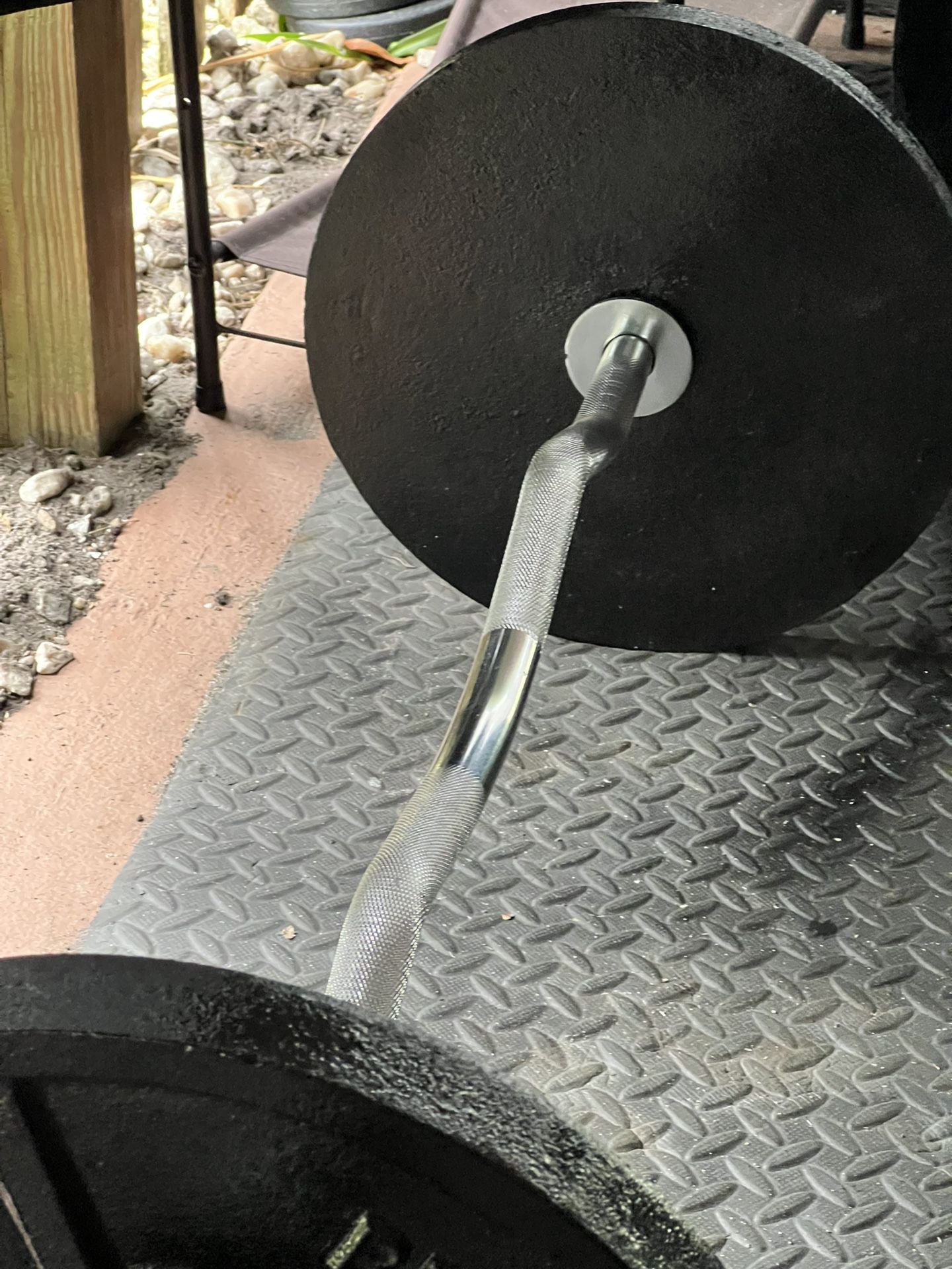 (2) Olympic 35lb Plates (2) Clamps (1) Chrome Hollow Curl Bar