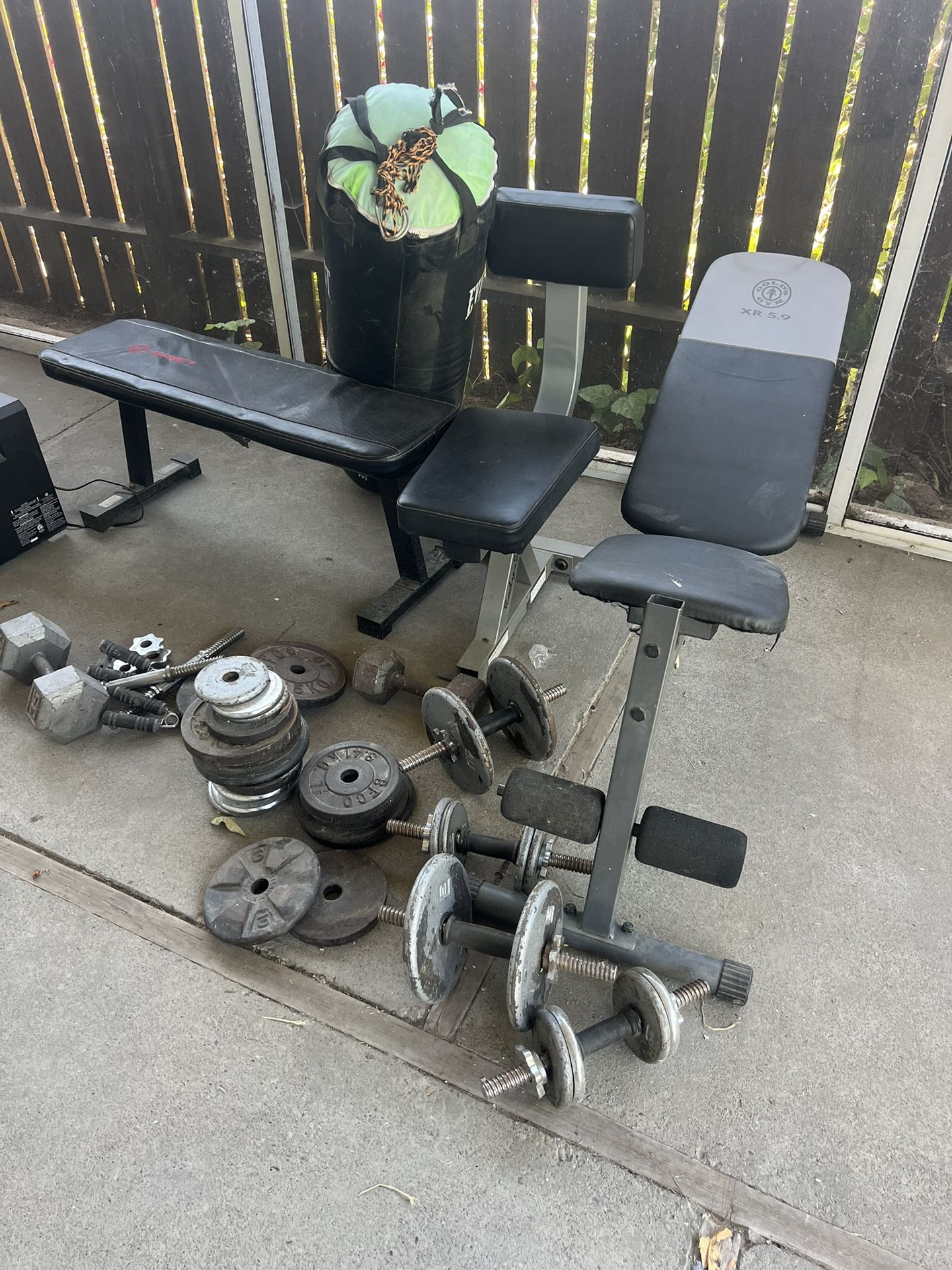 About 270 Pounds In Weights. 3 Benches And A Boxing Bag.