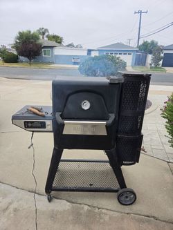 Masterbuilt gravity fed, charcoal briquette smoker.