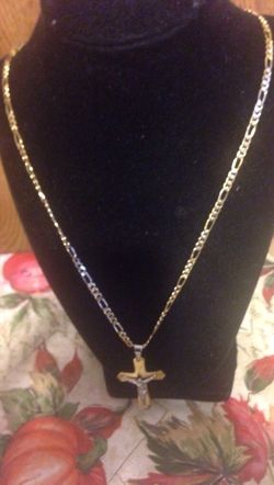 18Karats Rolled Gold crucifix with Figaro22inches chain