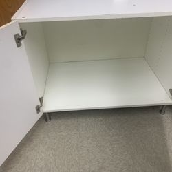 3 white cabinets