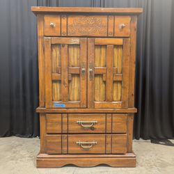 Rustic Brown Wood Armoire with Carved Details