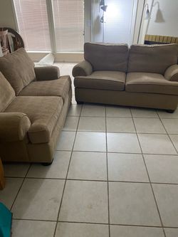 Two Tan Fabric Loveseats