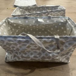 Collapsible storage bins with handles organizing totes