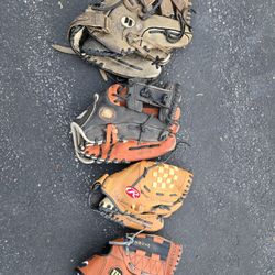 Four Baseball Gloves